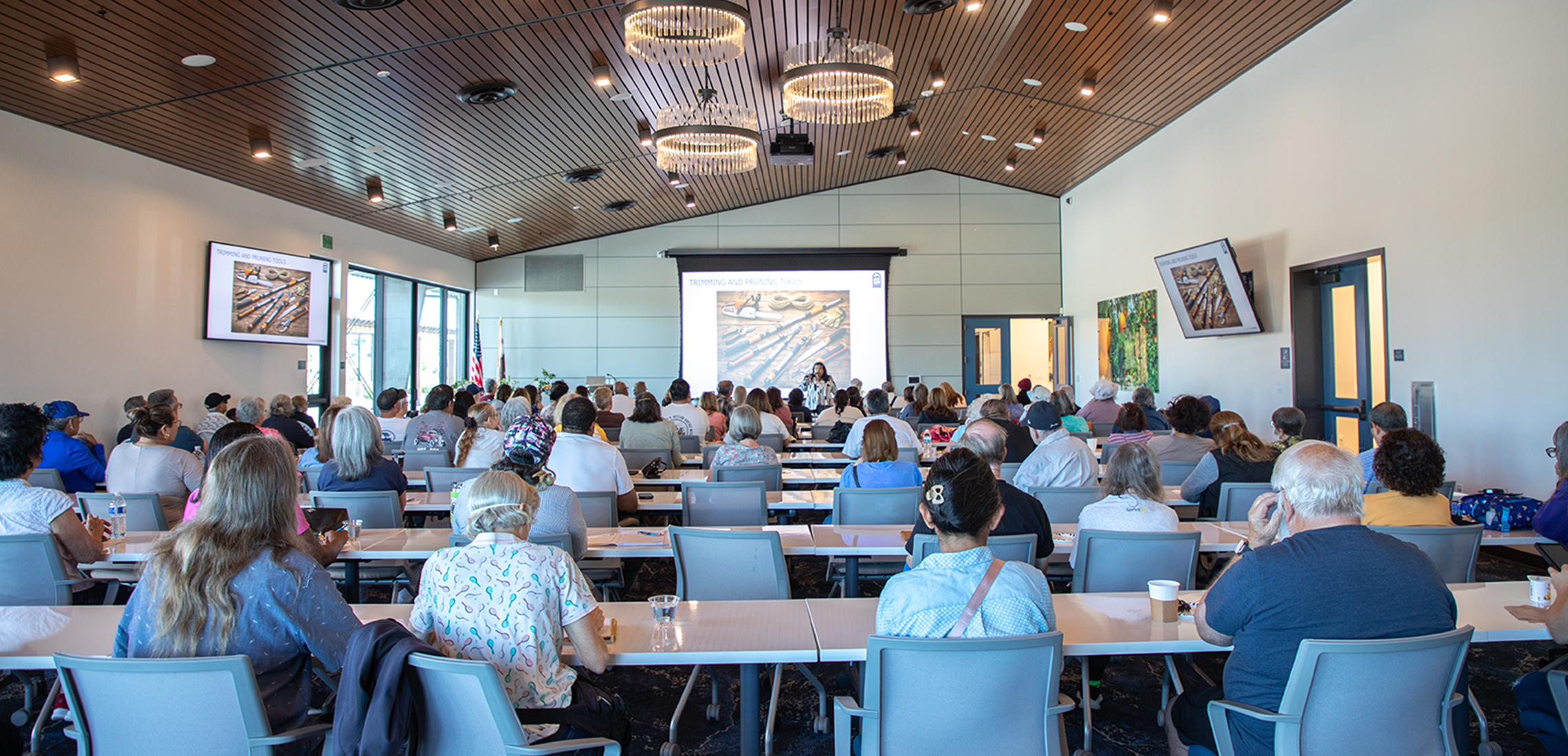 Woman presenting to a group of people 