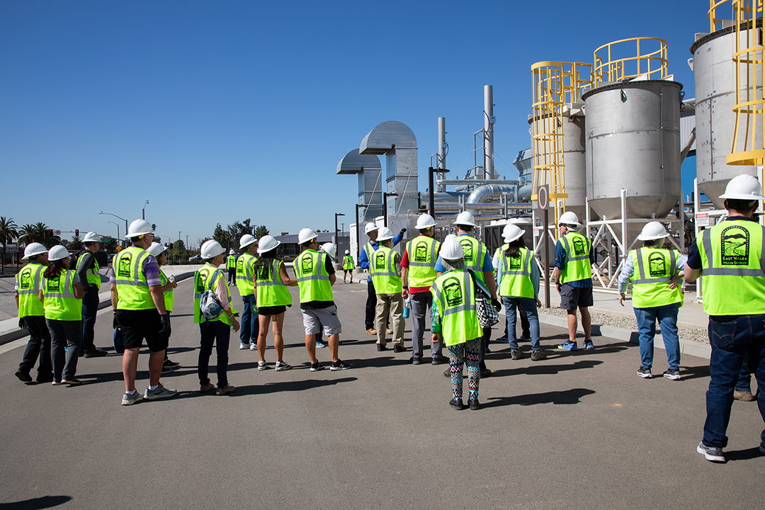 Picture of people wearing safety vests touring the Sterling Natural Resource Center. 